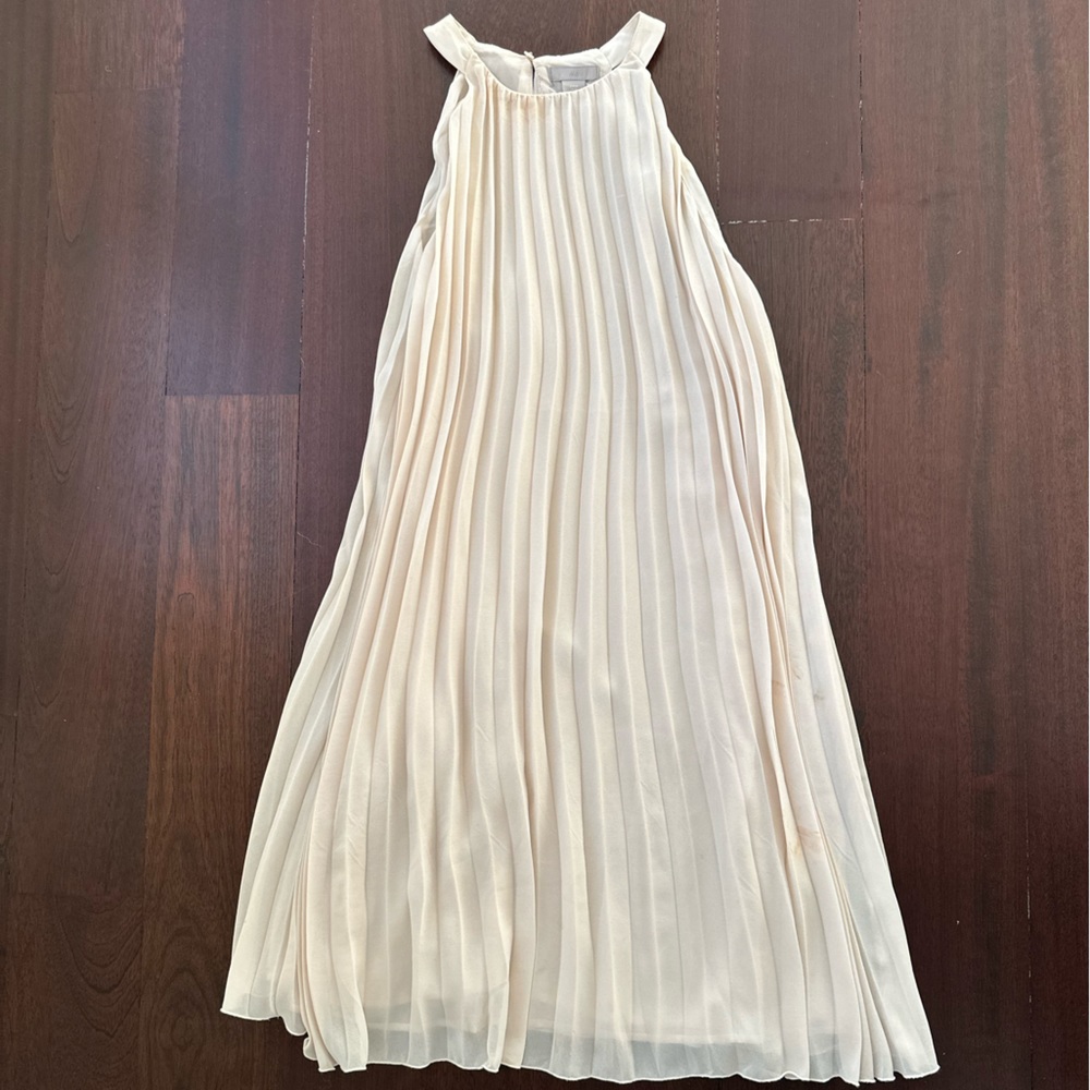 Flowy H&M cocktail dress. Cream colored . Gently used. Size Medium .